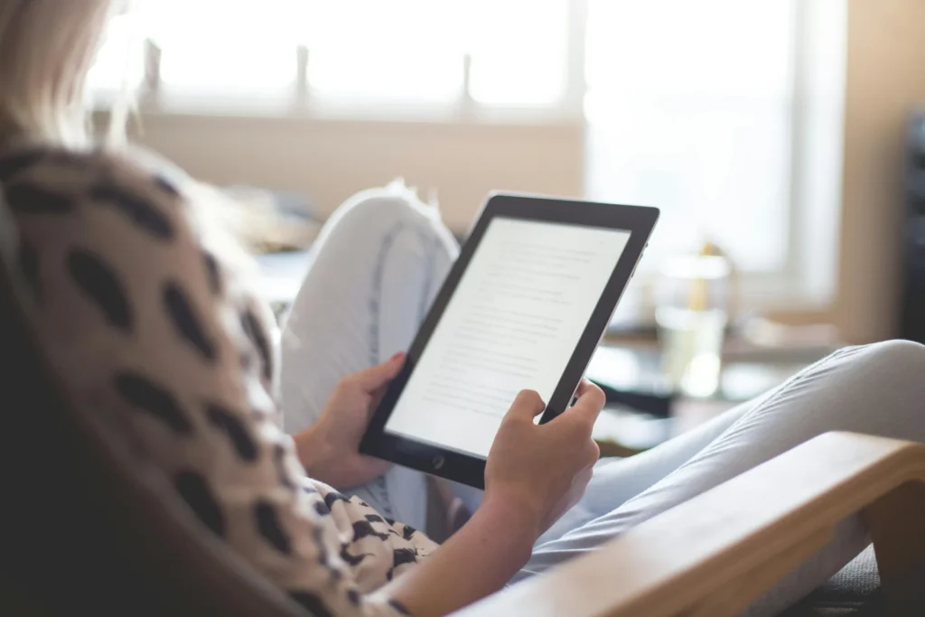 Woman reading in her tablet